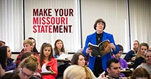 Make your Missouri Statement: Teacher reading to a class from a textbook