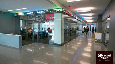 Zoom background: Glass Hall BKD Financial Trading Lab.